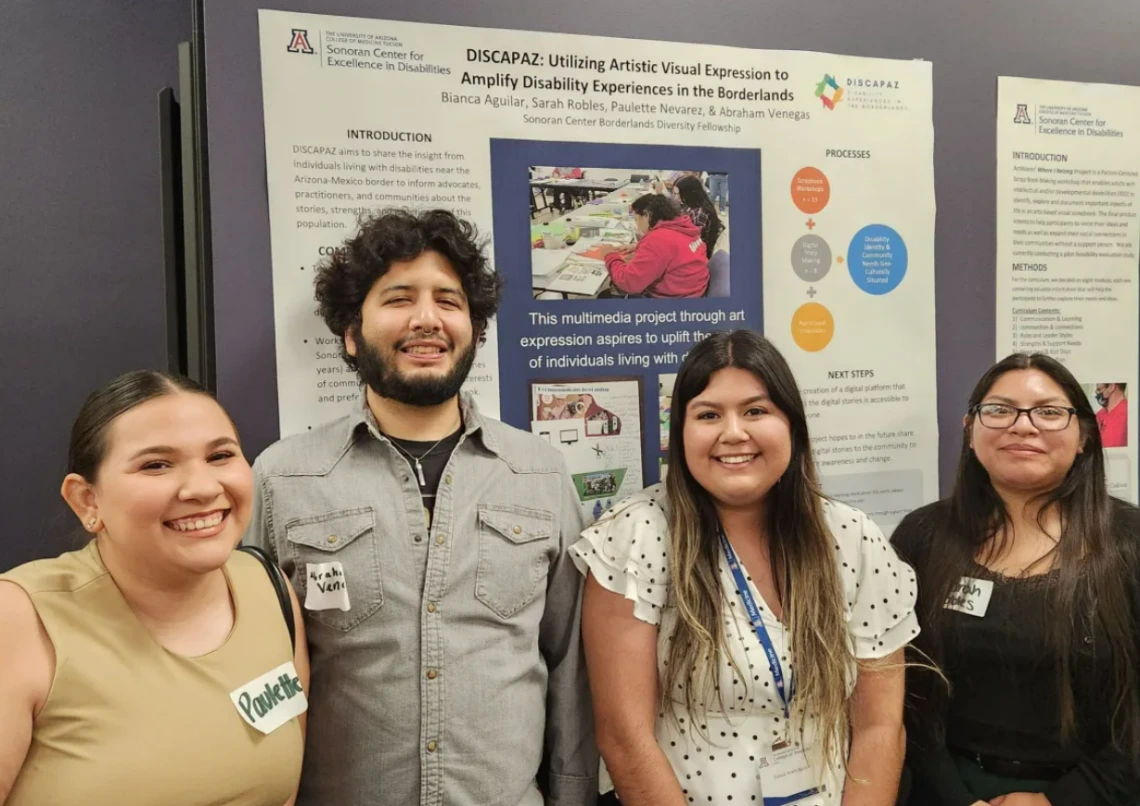 A group of students smiling in front of a research poster presentation